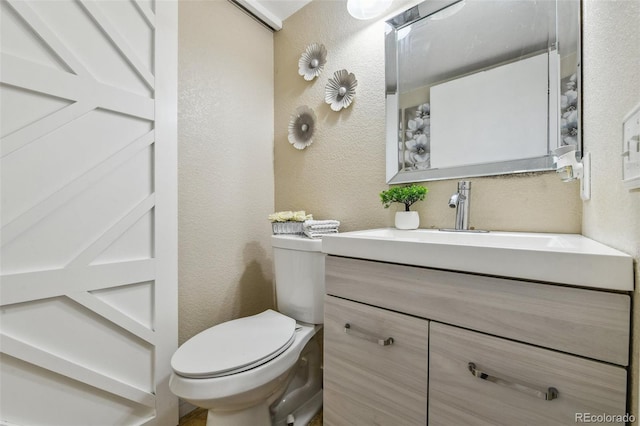 20651 E 42nd Ave, Denver, CO 80249 - half bathroom featuring a textured wall and vanity