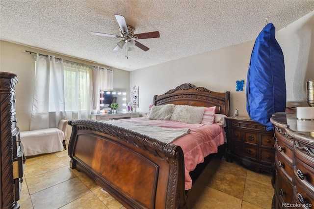 20651 E 42nd Ave, Denver, CO 80249 - bedroom featuring a textured ceiling, a ceiling fan, and tile patterned flooring