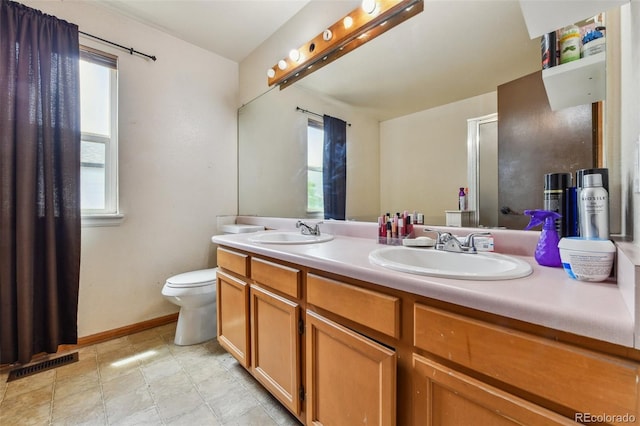 20651 E 42nd Ave, Denver, CO 80249 - bathroom with double vanity and plenty of natural light