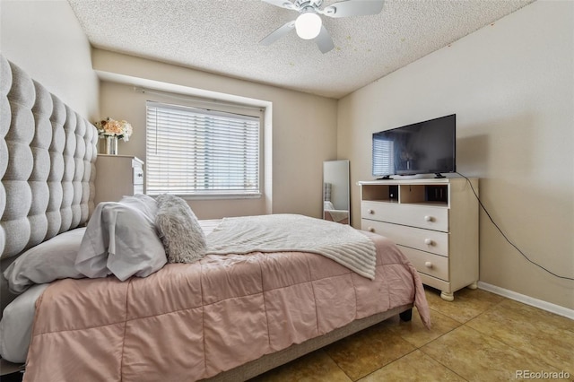 20651 E 42nd Ave, Denver, CO 80249 - bedroom with a textured ceiling, light tile patterned flooring, and a ceiling fan