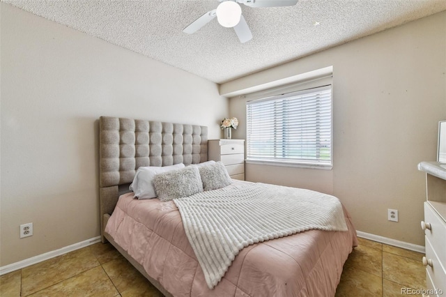 20651 E 42nd Ave, Denver, CO 80249 - tiled bedroom featuring a textured ceiling and a ceiling fan
