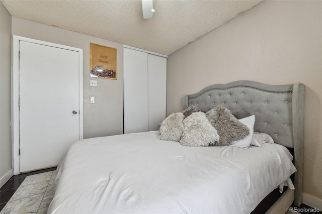 20651 E 42nd Ave, Denver, CO 80249 - bedroom with a closet, ceiling fan, and a textured ceiling