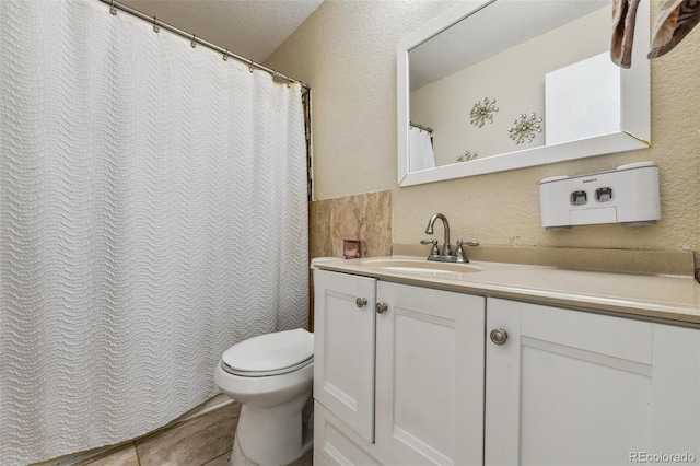 20651 E 42nd Ave, Denver, CO 80249 - full bathroom featuring vanity, a textured wall, and a shower with shower curtain