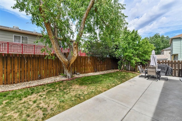 20651 E 42nd Ave, Denver, CO 80249 - fenced backyard with a patio area and outdoor dining space