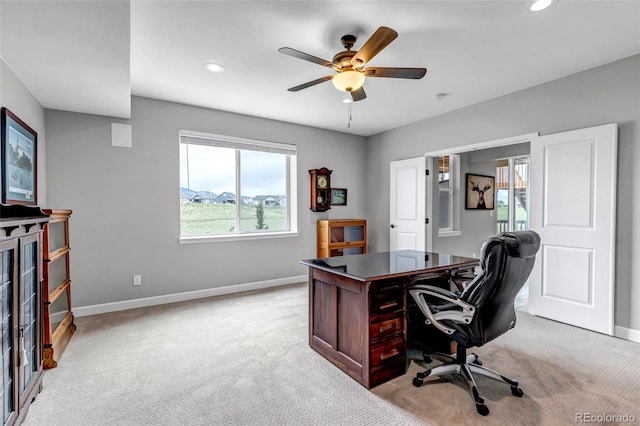 9055 Swan River St, Littleton, CO 80125 - home office with light carpet, recessed lighting, and ceiling fan