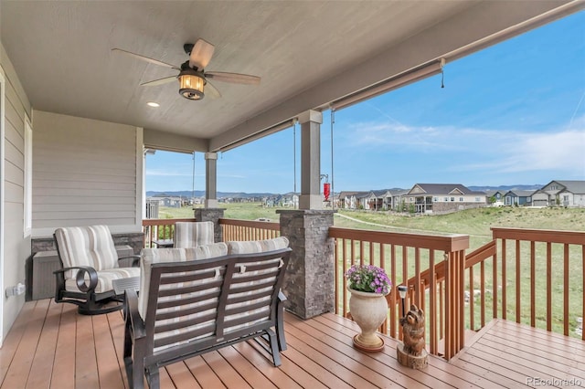 9055 Swan River St, Littleton, CO 80125 - deck with a ceiling fan and a residential view