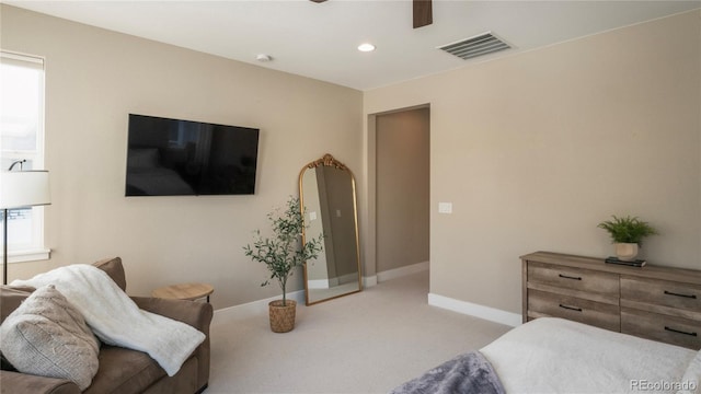 bedroom with light carpet and ceiling fan