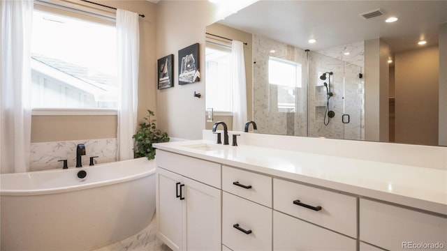 bathroom with vanity and plus walk in shower