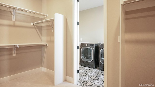 clothes washing area with washer and dryer