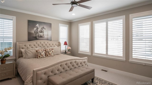 carpeted bedroom with multiple windows, crown molding, and ceiling fan