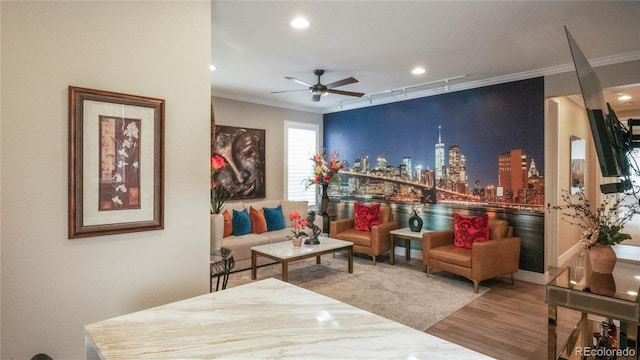 living room featuring ornamental molding, hardwood / wood-style floors, and ceiling fan