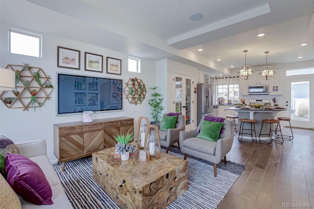 living room featuring wood finished floors and recessed lighting