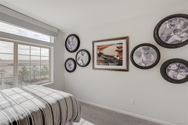 carpeted bedroom with baseboards