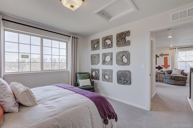 bedroom featuring baseboards, carpet, visible vents, and attic access