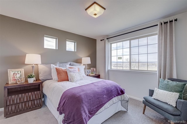 bedroom featuring carpet floors and baseboards