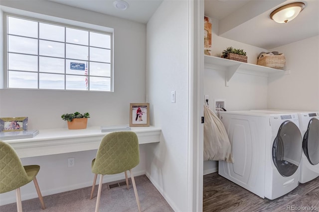 laundry room featuring laundry area, baseboards, and washing machine and clothes dryer