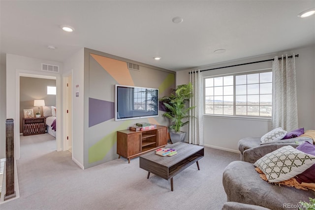 living area with light carpet, baseboards, visible vents, and recessed lighting