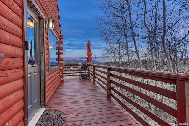 wooden deck with a mountain view