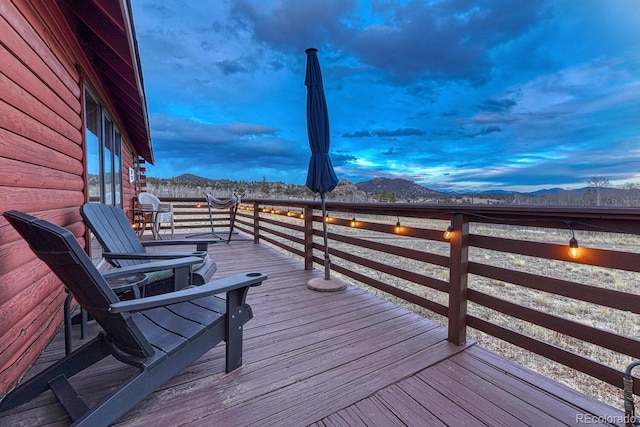 wooden terrace featuring a mountain view