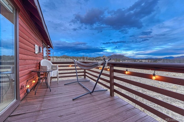 wooden terrace with a mountain view