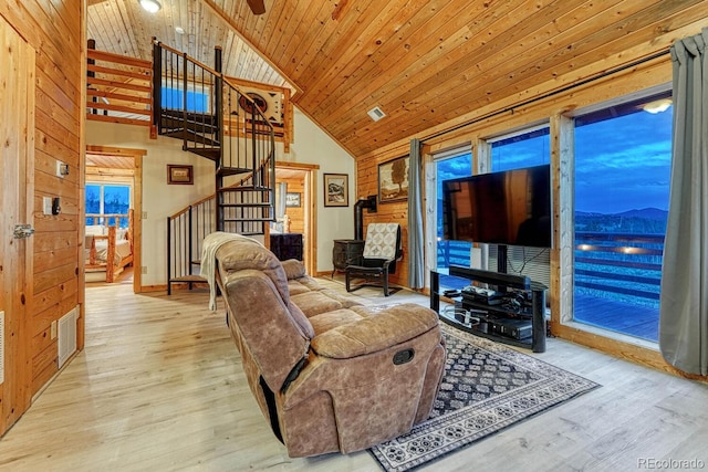 living area with wood finished floors, visible vents, high vaulted ceiling, stairs, and wood ceiling