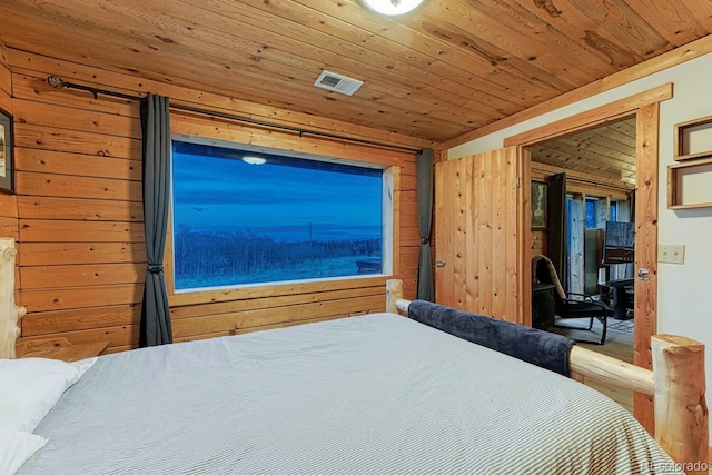 bedroom featuring access to exterior, wood ceiling, visible vents, and wood walls