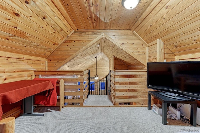 bedroom featuring wooden walls, wood ceiling, carpet, and vaulted ceiling