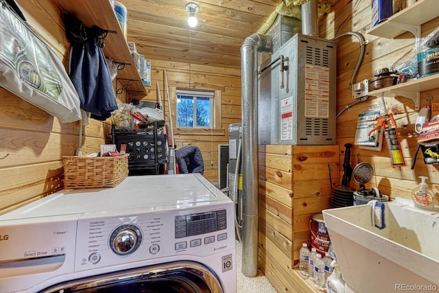 laundry area featuring a sink, washer / clothes dryer, wooden walls, wood ceiling, and laundry area