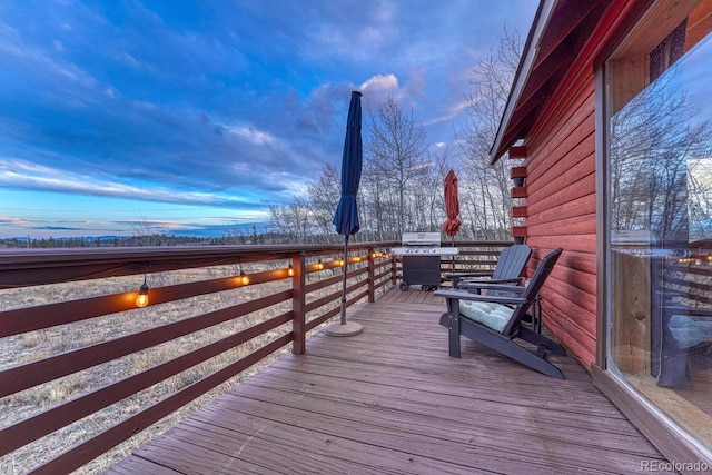 wooden deck featuring grilling area