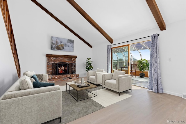 living room featuring visible vents, a brick fireplace, beam ceiling, wood finished floors, and high vaulted ceiling