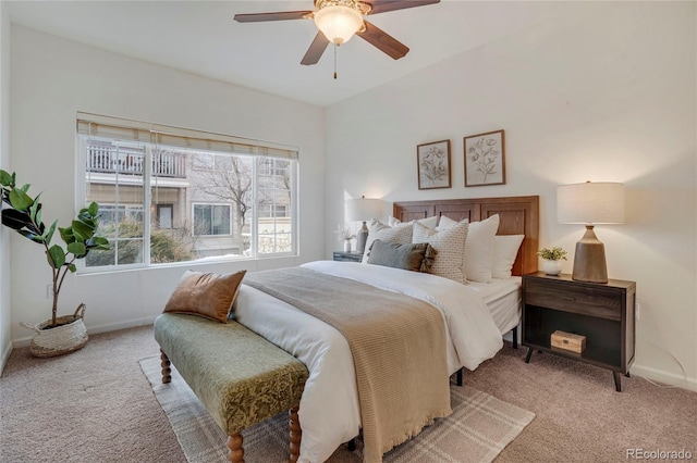 carpeted bedroom featuring a ceiling fan and baseboards