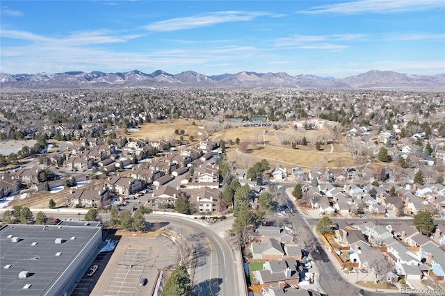 drone / aerial view featuring a residential view and a mountain view