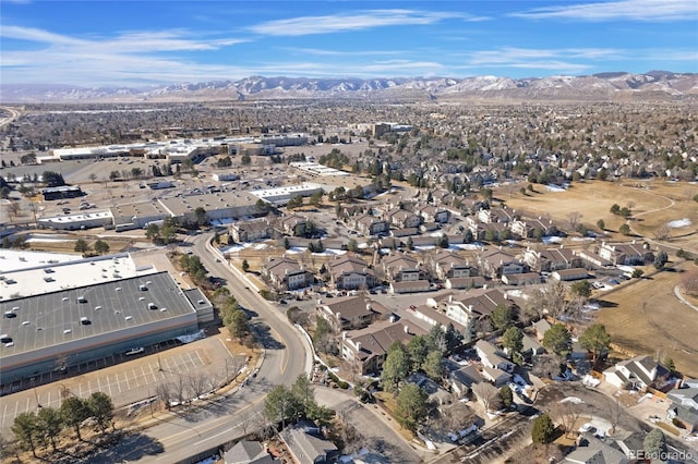 drone / aerial view featuring a residential view and a mountain view