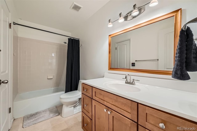 full bathroom with shower / bath combo, vanity, tile patterned floors, and toilet