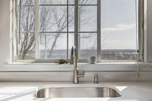 room details featuring a sink and light countertops