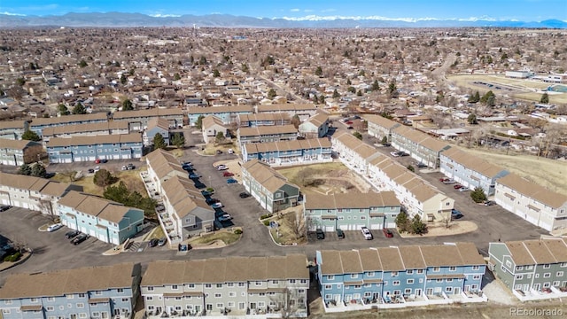 birds eye view of property with a mountain view and a residential view