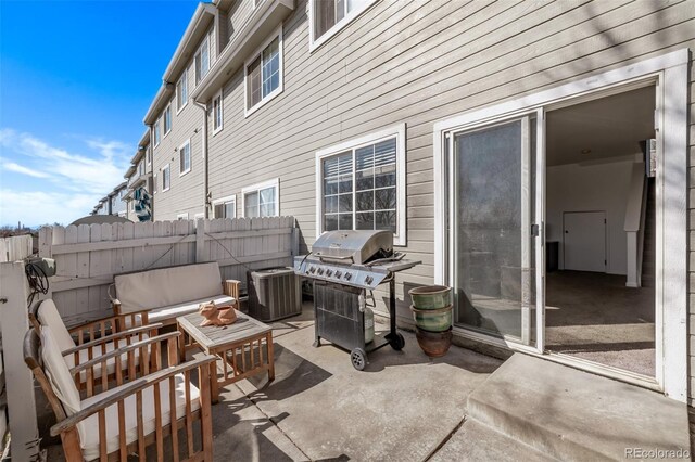 view of patio / terrace featuring outdoor lounge area, cooling unit, fence, and grilling area