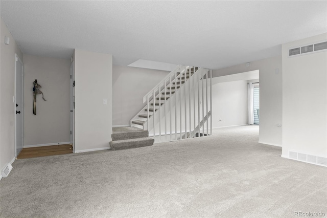 4262 E Maplewood Way, Centennial, CO 80121 - unfurnished living room with carpet floors, baseboards, and stairway