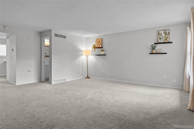 4262 E Maplewood Way, Centennial, CO 80121 - empty room with a textured ceiling, carpet flooring, baseboards, and a smoke detector