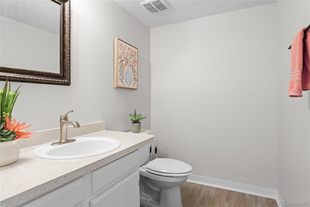 4262 E Maplewood Way, Centennial, CO 80121 - half bath with toilet, vanity, and wood finished floors