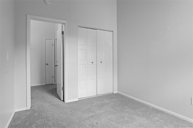 4262 E Maplewood Way, Centennial, CO 80121 - unfurnished bedroom with carpet floors, baseboards, and a closet