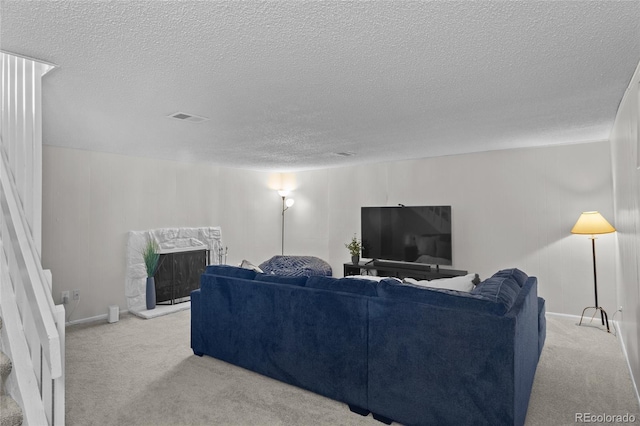 4262 E Maplewood Way, Centennial, CO 80121 - living room with a textured ceiling, carpet, and a high end fireplace