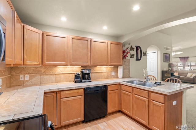 kitchen featuring sink, tile countertops, kitchen peninsula, and dishwasher