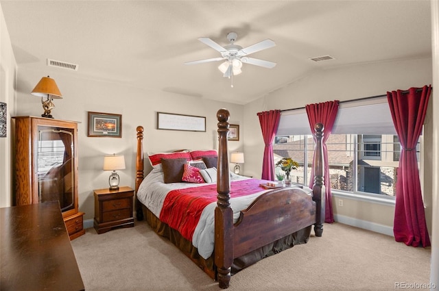 carpeted bedroom featuring ceiling fan and vaulted ceiling