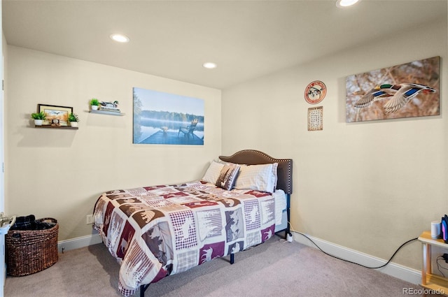 bedroom with light colored carpet