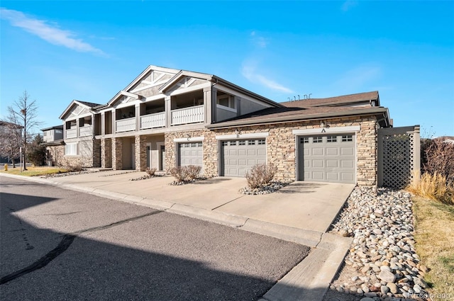 view of front facade with a garage and a balcony