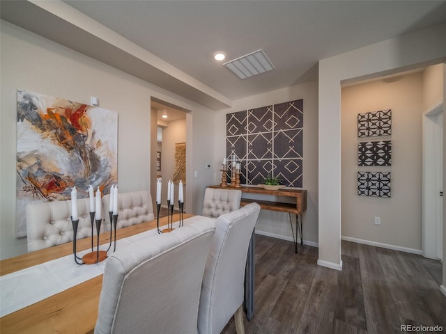 dining area featuring dark wood-type flooring