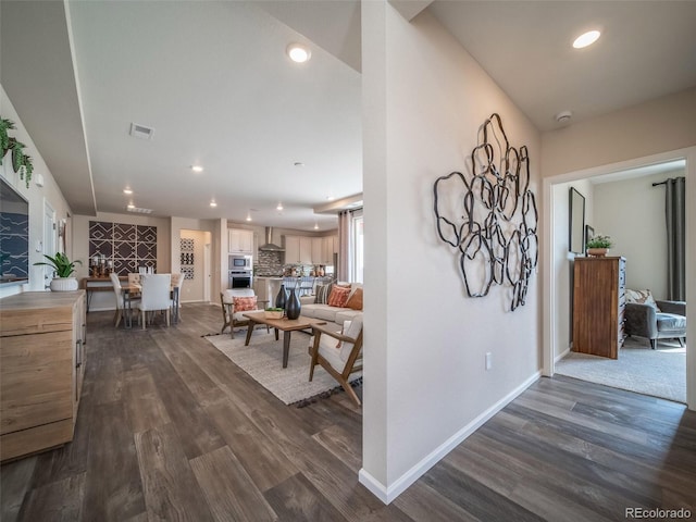 hallway with dark hardwood / wood-style floors