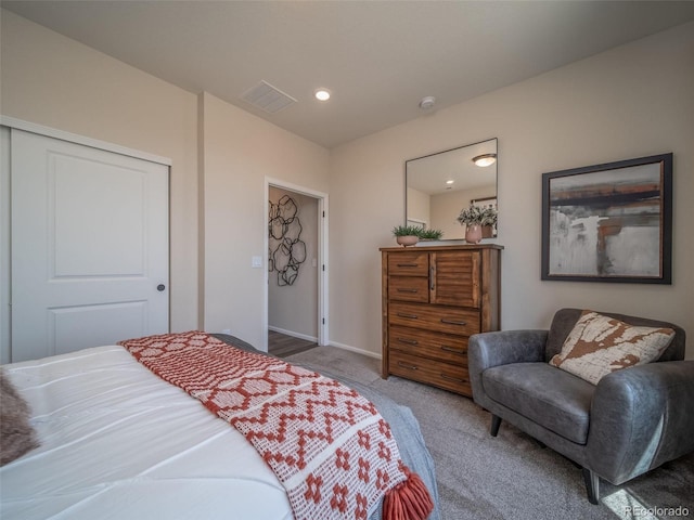 carpeted bedroom with a closet