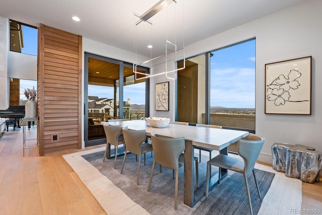 dining area featuring recessed lighting and wood finished floors